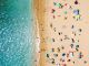 People Crowd Relaxing On Beach In Portugal Canvas Print