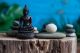 Grey Zen Stones With Statue Of Buddha And Fresh White Flowers Canvas Print