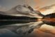 Mountain Lake and Traffic Light Trail with Reflection and Fog at Sunset Canvas Print
