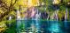 Waterfall in Green Forest with Blue Lake Canvas Print